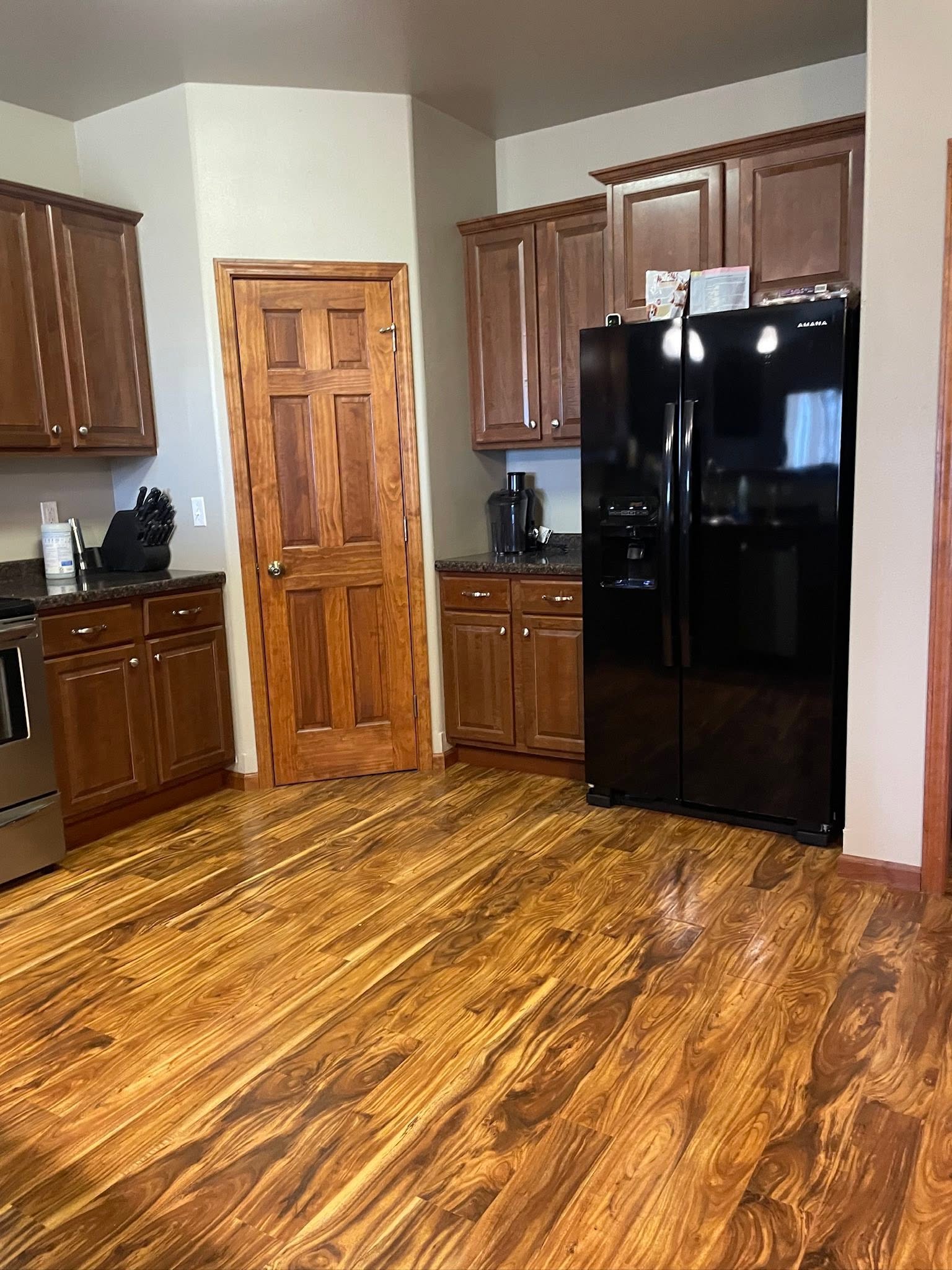 Freshly cleaned kitchen with shining floors and appliances